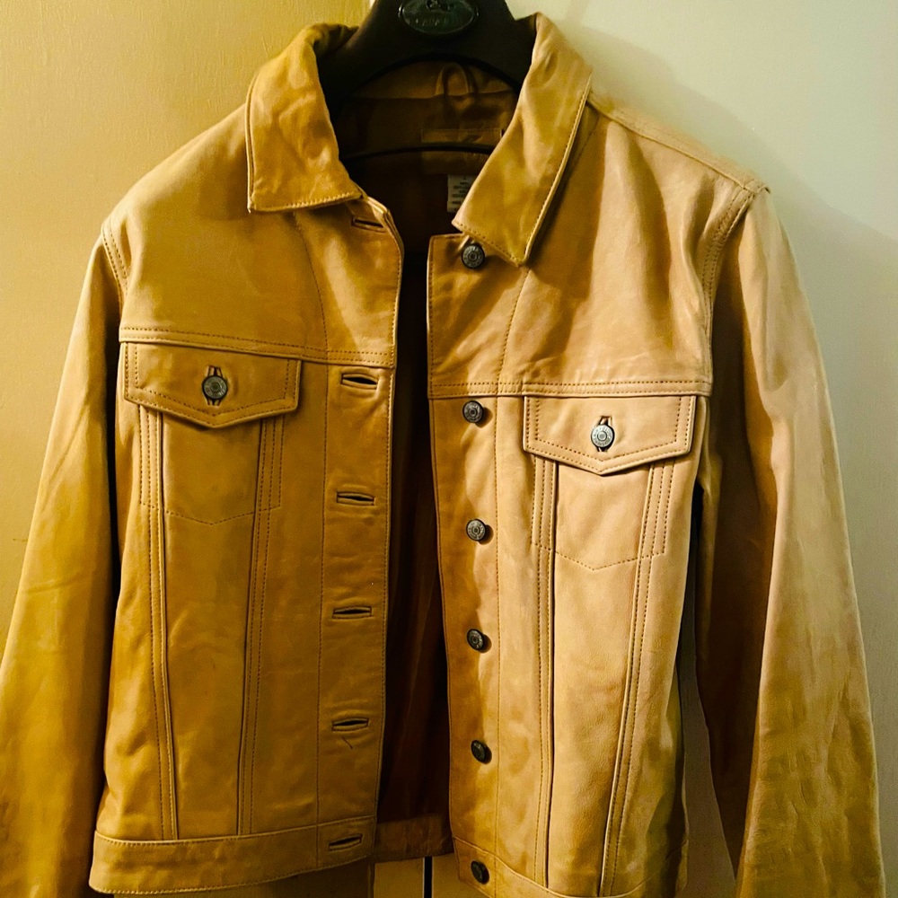 Beautiful genuine leather Jean jacket - The color is Tan . Normal used condition